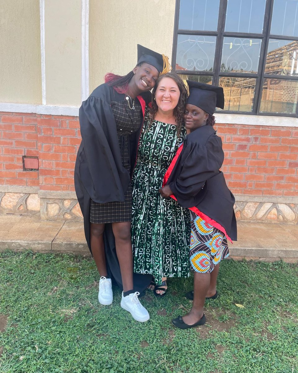 Amanda Rehfeldt with two graduates in Uganda